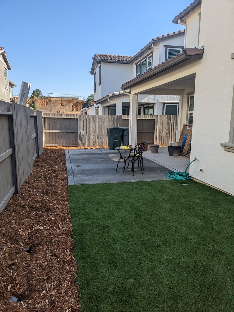 Striped artificial turf with concrete border